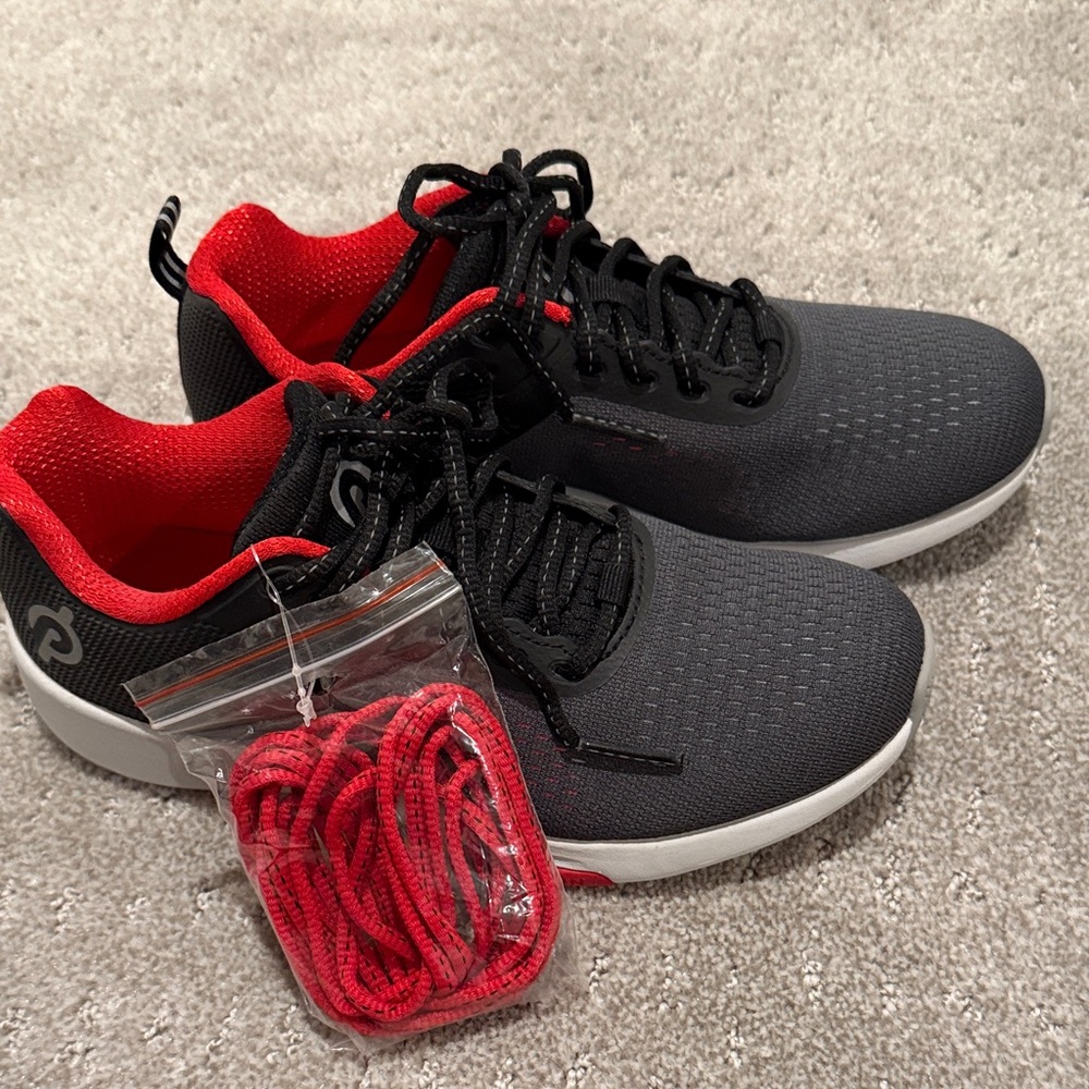Brand new Peloton Sneakers. Black and Red. Size 6.